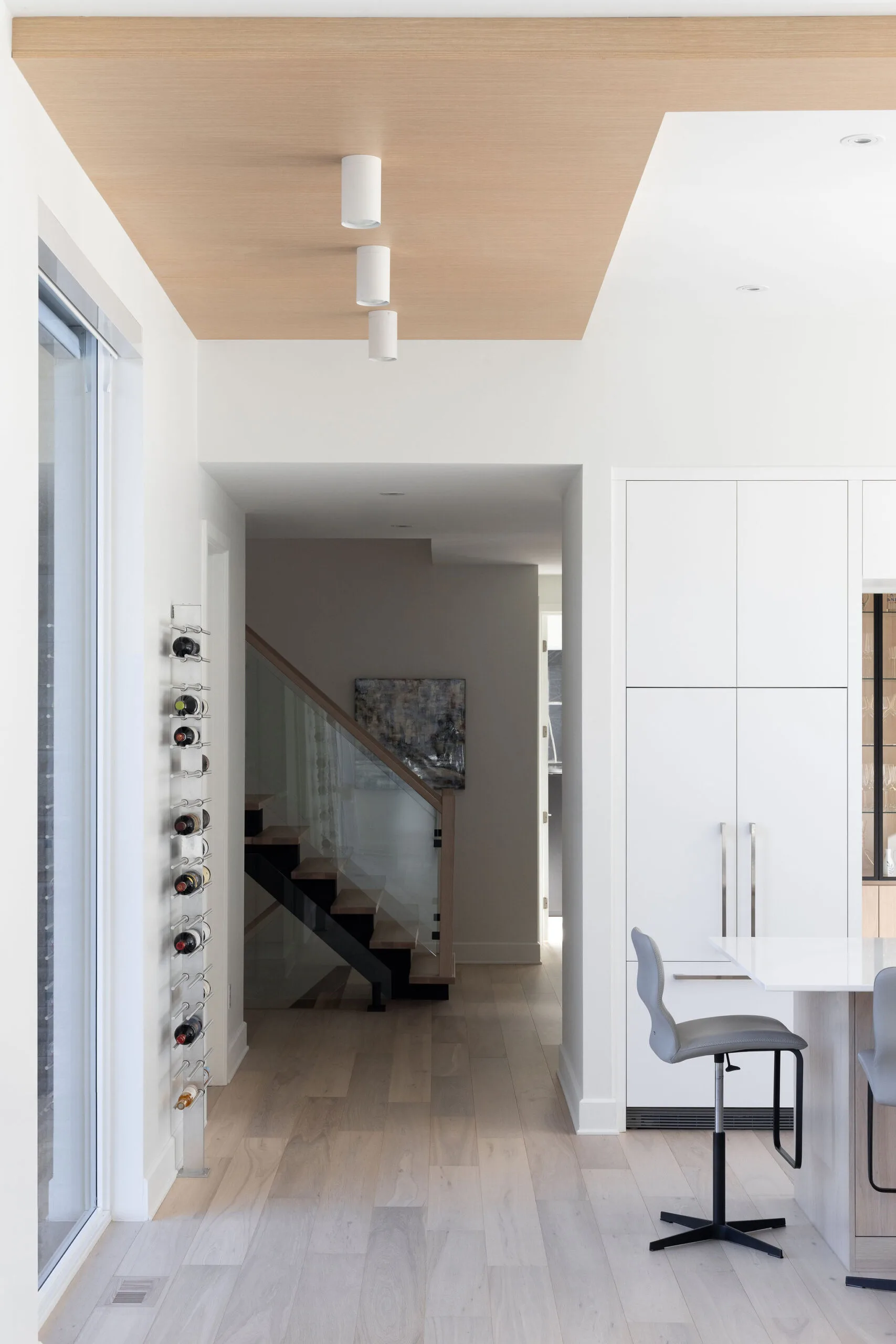 Hallway with opened staircase and wood ceiling design