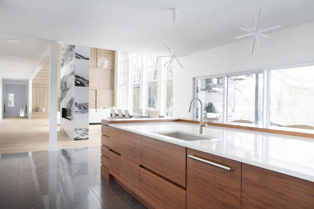 Modern kitchen with walnut cabinetry with large island