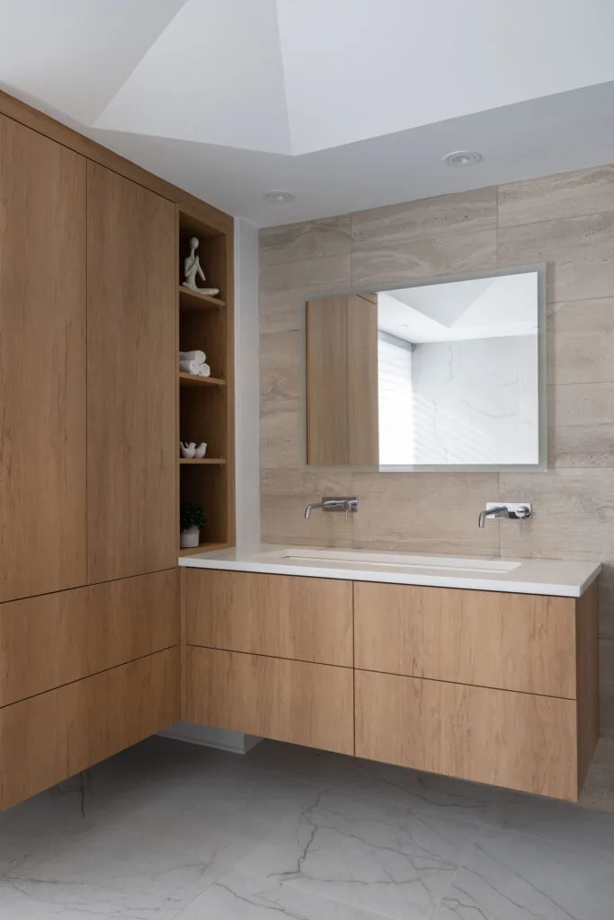 Elegant luxury condominium bathroom showcasing refined finishes, premium materials, and a cohesive modern design. The carefully curated details, sophisticated fixtures, and balanced lighting create a serene, high-end atmosphere that blends comfort with timeless style.