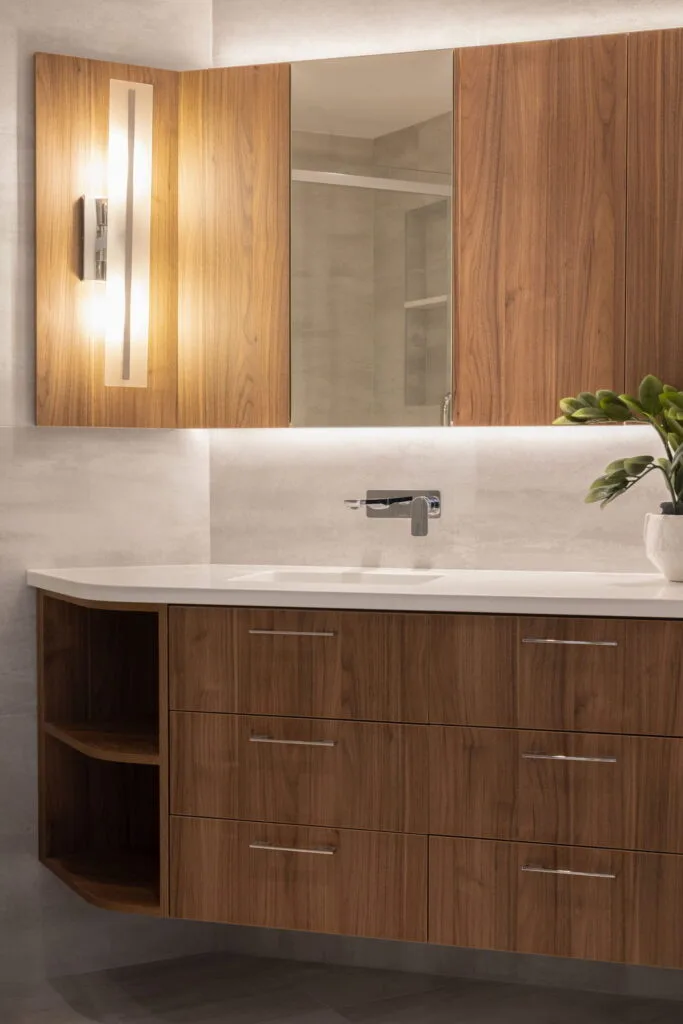 Luxury condominium bathroom vanity featuring custom cabinetry, premium countertop materials, elegant fixtures, and refined finishes that enhance both functionality and modern aesthetic appeal.