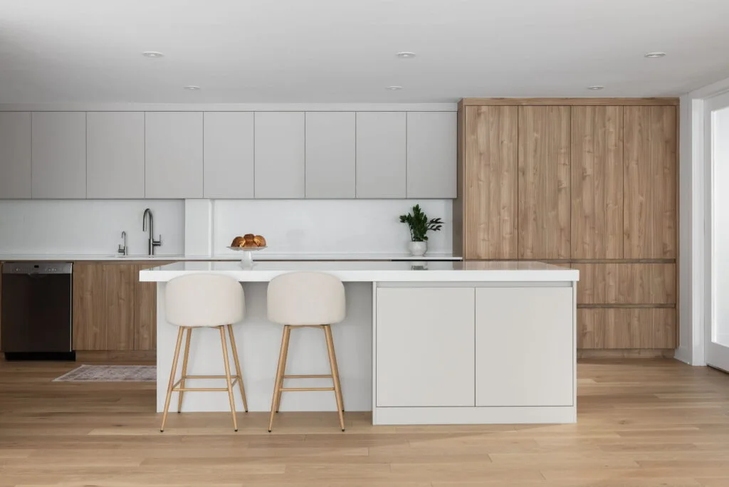 Open-concept luxury condo interior renovation combining modern architecture, sophisticated materials, and cohesive design throughout the living spaces.